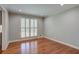 Bright, open living room with hardwood floors and natural light from the large window at 1840 Linwood Ave, Atlanta, GA 30344