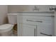 Cozy powder room showcasing a modern vanity with granite countertop and updated fixtures at 1840 Linwood Ave, Atlanta, GA 30344