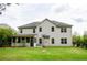 Large, level backyard featuring a screened porch and basketball hoop at 2535 Castlerock Ct, Cumming, GA 30041