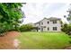 Expansive backyard with screened porch and mature trees at 2535 Castlerock Ct, Cumming, GA 30041