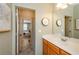 Bright bathroom featuring modern fixtures and a mirror, and drawers, and a doorway to the bedroom at 2535 Castlerock Ct, Cumming, GA 30041