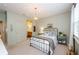 Comfortable bedroom with neutral colors, natural light, and stylish decor and furnishings at 2535 Castlerock Ct, Cumming, GA 30041