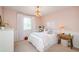A light-filled bedroom with stylish decor, a full bed, and comfortable furnishings at 2535 Castlerock Ct, Cumming, GA 30041