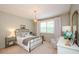 Stylish bedroom with a decorative mirror, full bed, and comfortable furnishings at 2535 Castlerock Ct, Cumming, GA 30041