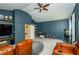 Large bonus room with comfortable seating, a flat-screen TV, and built-in shelves for toys and games at 2535 Castlerock Ct, Cumming, GA 30041