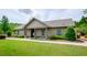 Community clubhouse with well-maintained lawn and inviting entrance at 2535 Castlerock Ct, Cumming, GA 30041