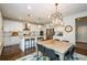 Beautiful kitchen with white cabinets, granite counters, stainless steel appliances, and a large island at 2535 Castlerock Ct, Cumming, GA 30041