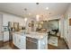 Spacious kitchen with stainless steel appliances and a view into the living room at 2535 Castlerock Ct, Cumming, GA 30041