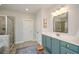 A bathroom featuring a glass enclosed shower, and a vanity with cabinets and drawers at 2535 Castlerock Ct, Cumming, GA 30041