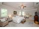 Serene main bedroom with tray ceiling, plantation shutters, and neutral color palette at 2535 Castlerock Ct, Cumming, GA 30041