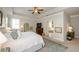 Spacious main bedroom with tray ceilings and a doorway leading to the ensuite bath at 2535 Castlerock Ct, Cumming, GA 30041