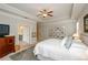 Comfortable main bedroom with a ceiling fan, tray ceiling and bright natural light at 2535 Castlerock Ct, Cumming, GA 30041