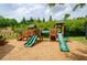 Community playground with slides and play structures at 2535 Castlerock Ct, Cumming, GA 30041