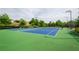Enjoy a friendly match on the community tennis courts, featuring blue courts, and a beautiful landscape for relaxation at 2535 Castlerock Ct, Cumming, GA 30041