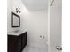 Bathroom featuring dark wood cabinets, white countertops, and walk-in shower, creating a modern feel at 6851 Roswell Rd # L1, Atlanta, GA 30328