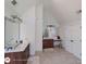 Large bathroom with tiled floor, separate vanities, and ample space at 1292 Hidden Spirit Trl, Lawrenceville, GA 30045