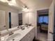 Bright bathroom with double sinks and a large mirror at 1292 Hidden Spirit Trl, Lawrenceville, GA 30045