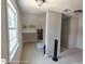Bright bedroom features neutral carpet, a window, a black fan, and a walk-in closet at 1292 Hidden Spirit Trl, Lawrenceville, GA 30045