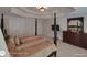 Primary bedroom features a four poster bed, a tray ceiling, and a wooden dresser at 1292 Hidden Spirit Trl, Lawrenceville, GA 30045
