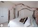 Bedroom featuring a stylish four-poster bed and double closets, providing ample storage at 1292 Hidden Spirit Trl, Lawrenceville, GA 30045