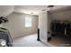 Bedroom with neutral carpet, a window, a black fan, and a closet with clothes at 1292 Hidden Spirit Trl, Lawrenceville, GA 30045