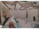 Inviting bedroom with a canopy bed, stylish pillows, and a decorative floral arrangement, creating a relaxing ambiance at 1292 Hidden Spirit Trl, Lawrenceville, GA 30045