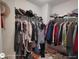 Walk-in closet with organized shelving and hanging racks, providing ample storage space for clothing and accessories at 1292 Hidden Spirit Trl, Lawrenceville, GA 30045