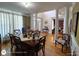 Spacious dining room featuring hardwood floors, elegant columns, and neutral decor at 1292 Hidden Spirit Trl, Lawrenceville, GA 30045