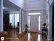 Inviting foyer with hardwood floors, a stylish front door, and classic architectural details at 1292 Hidden Spirit Trl, Lawrenceville, GA 30045