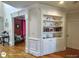 Elegant living room featuring built-in shelving and a doorway to other parts of the house at 1292 Hidden Spirit Trl, Lawrenceville, GA 30045