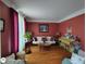 Cozy living room featuring hardwood floors, a comfortable sofa, and elegant decor at 1292 Hidden Spirit Trl, Lawrenceville, GA 30045