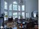 Bright living room with two story windows, a chandelier, and hardwood floors at 1292 Hidden Spirit Trl, Lawrenceville, GA 30045