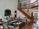 Elegant living room showcasing hardwood floors, a staircase, and an open floor plan at 1292 Hidden Spirit Trl, Lawrenceville, GA 30045