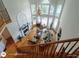 Living room featuring high ceilings, large windows, and an elegant chandelier at 1292 Hidden Spirit Trl, Lawrenceville, GA 30045
