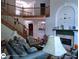 Inviting living room featuring hardwood floors, a staircase, and a fireplace at 1292 Hidden Spirit Trl, Lawrenceville, GA 30045