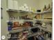 Organized pantry with shelves stocked with food and household items at 1292 Hidden Spirit Trl, Lawrenceville, GA 30045