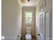 Toilet room featuring neutral paint and an open window at 1292 Hidden Spirit Trl, Lawrenceville, GA 30045