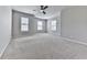 Bedroom with a ceiling fan, carpet, and three windows at 212 Torch Dr, Acworth, GA 30102