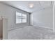 Bedroom featuring neutral carpet, a window, and white walls at 212 Torch Dr, Acworth, GA 30102