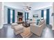 Cozy living room with a stone fireplace, comfortable seating, and elegant decor at 212 Torch Dr, Acworth, GA 30102