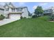 Spacious backyard featuring lush green grass and mature trees, perfect for outdoor activities and relaxation at 212 Torch Dr, Acworth, GA 30102