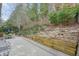 A backyard featuring a backyard patio and serene landscaping on a sunny day at 620 Willow Haven Way, Suwanee, GA 30024