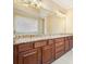 Elegant bathroom features granite countertop, double sink vanity with plenty of cabinet space at 620 Willow Haven Way, Suwanee, GA 30024