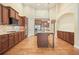 Spacious eat-in kitchen with wood cabinets, large island and stainless steel appliances at 620 Willow Haven Way, Suwanee, GA 30024