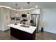 Bright kitchen with an island, stainless steel appliances, and modern finishes at 6751 Davidson Ct, Lithonia, GA 30058