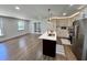 Open kitchen featuring a spacious island, and stainless-steel appliances at 6751 Davidson Ct, Lithonia, GA 30058