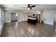 Open-concept living room and kitchen featuring hardwood floors at 6751 Davidson Ct, Lithonia, GA 30058