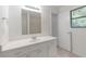 An updated bathroom with an extended vanity and mirror; perfect for getting ready! at 1240 Rocky Rd, Lawrenceville, GA 30044