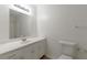 Bright bathroom featuring an extended vanity and mirror perfect for getting ready! at 1240 Rocky Rd, Lawrenceville, GA 30044
