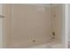 Bright bathroom featuring a large shower-tub with updated shower head and fixtures at 1240 Rocky Rd, Lawrenceville, GA 30044